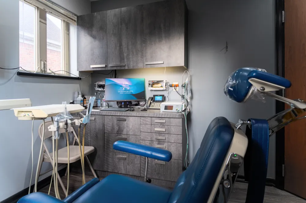 Treatment room with surgical equipment and computer workstation