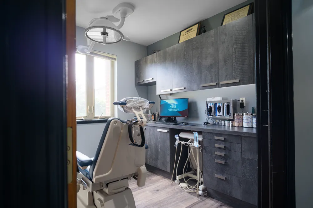 Treatment room with overhead surgical light and window