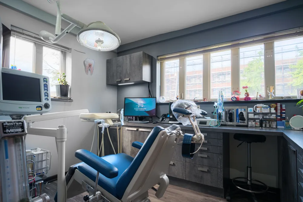 Spacious treatment room with large windows and monitoring equipment
