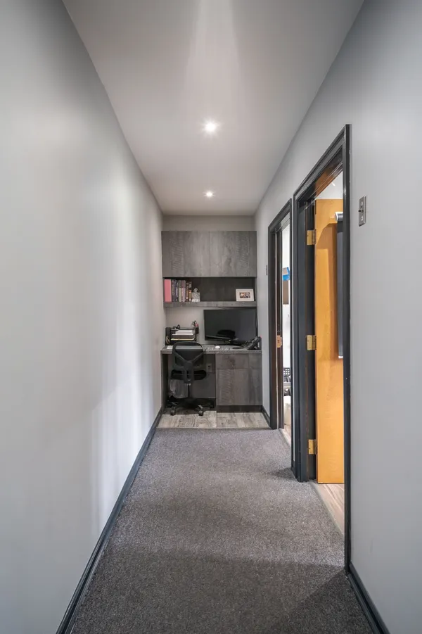 Hallway leading to treatment rooms at Queensboro Oral Surgery